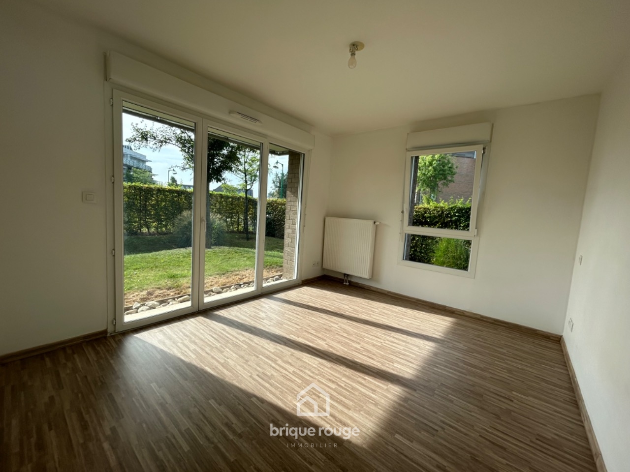 Vaste type3 pmr en rdc avec jardin   terrasse  2 parking Photo 1 - Brique Rouge Immobilier