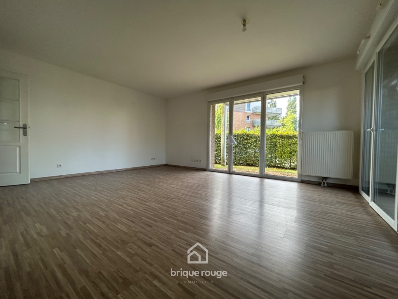 Vaste type3 pmr en rdc avec jardin   terrasse  2 parking Photo 3 - Brique Rouge Immobilier