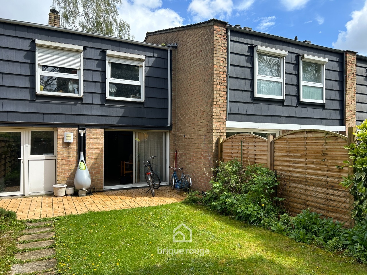Maison de lotissement 4 chambres jardin garage  Photo 1 - Brique Rouge Immobilier