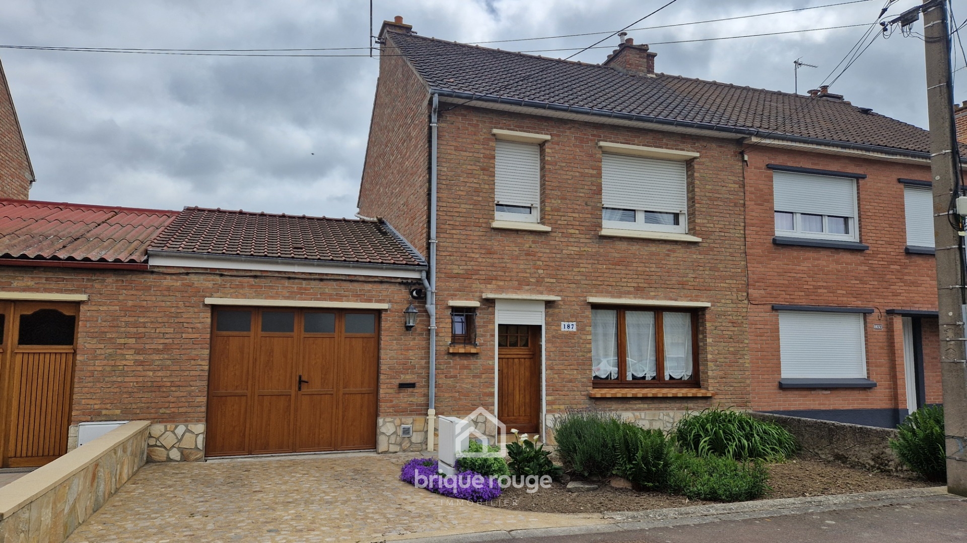 Maison 3 chambres avec jardin et garage Photo 1 - Brique Rouge Immobilier