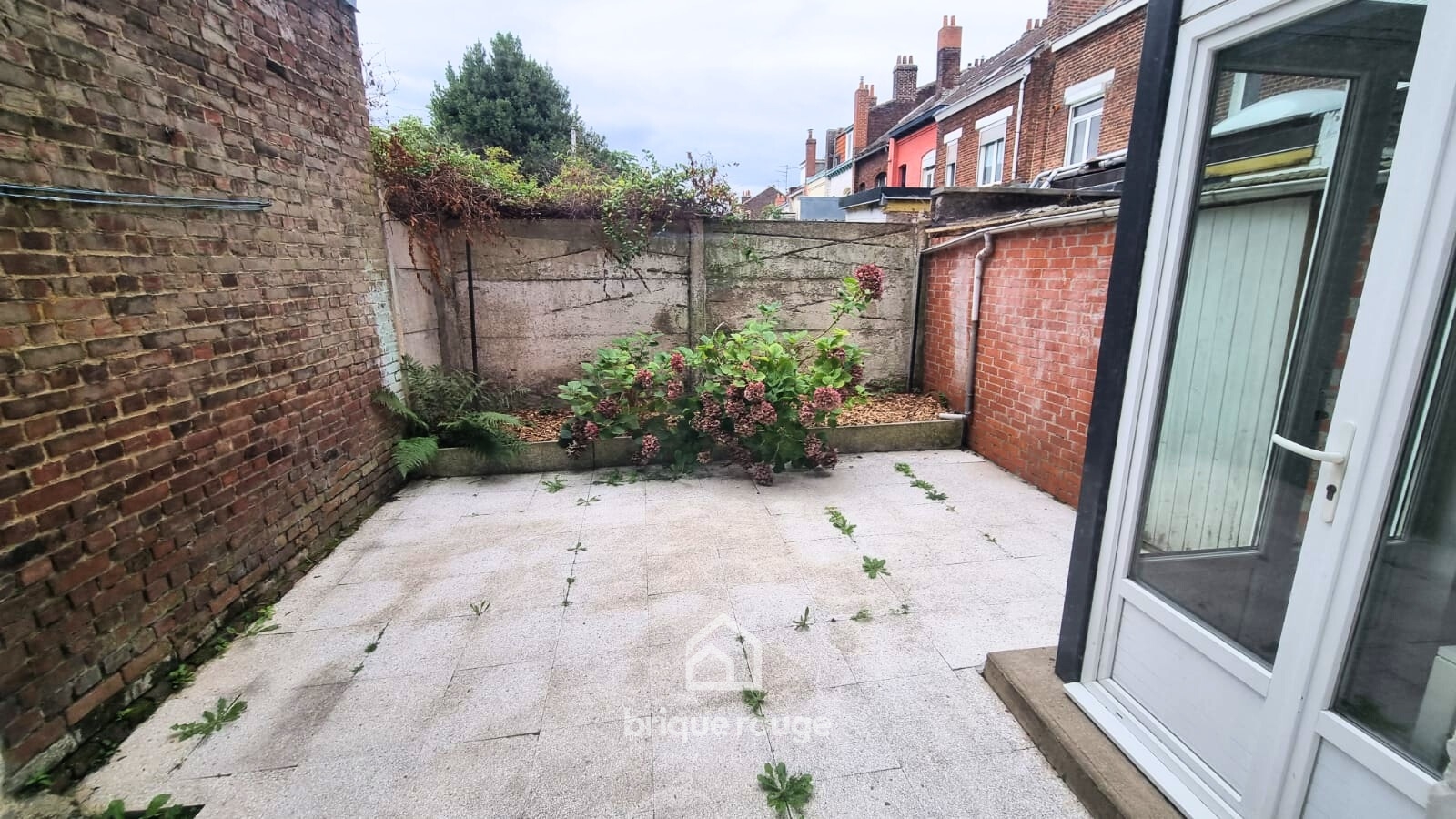 Immeuble de rapport comportant 3 appartements avec caves Photo 1 - Brique Rouge Immobilier