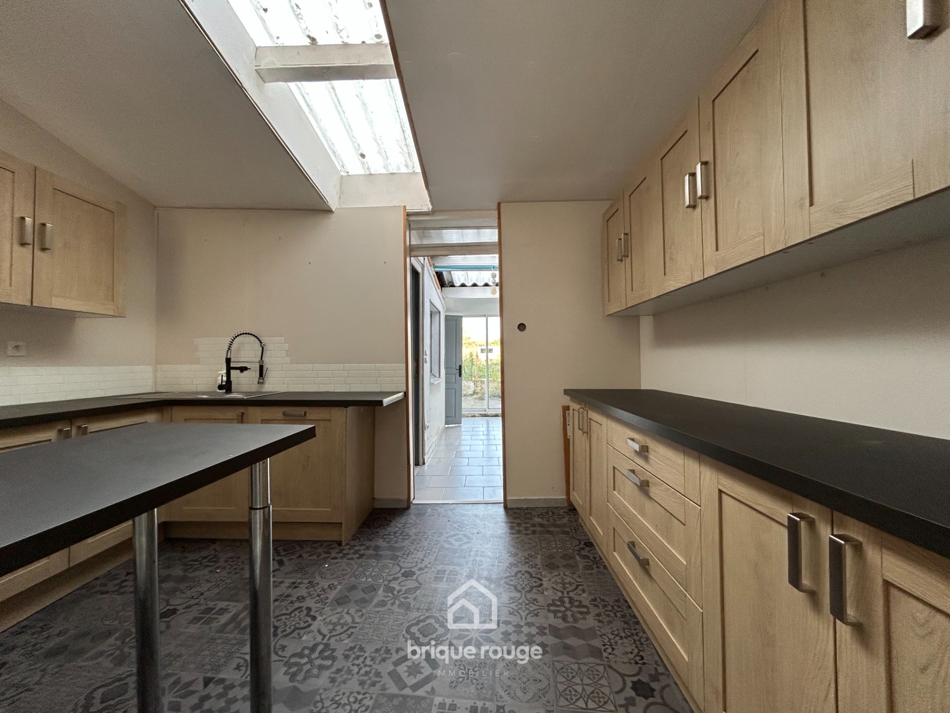 A vendre en exclusivite charmante maison 1930  Photo 2 - Brique Rouge Immobilier