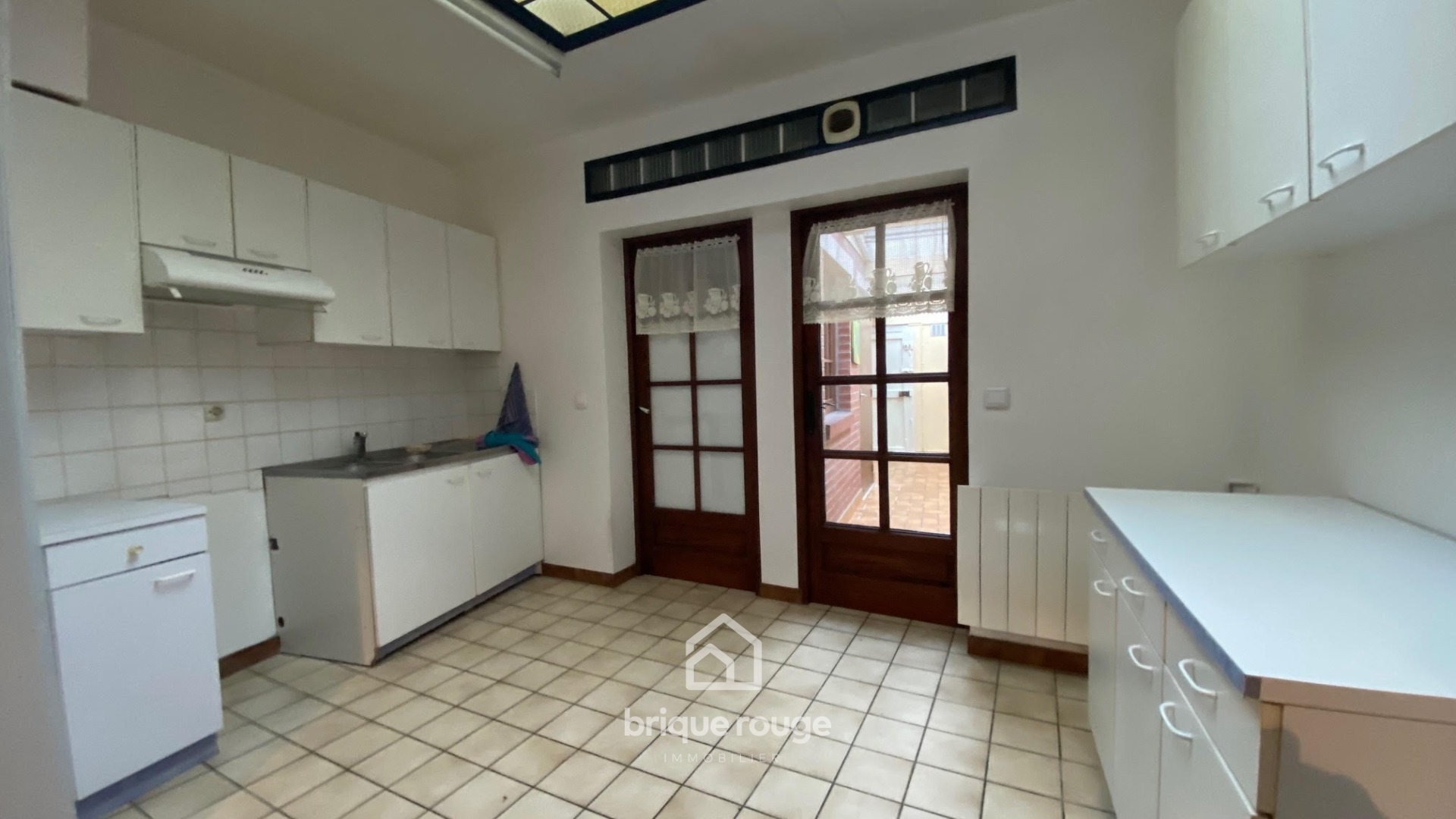 Maison 1930 2 chambres combles cour Photo 2 - Brique Rouge Immobilier Maison 1930 2 chambres combles cour Photo 2 - Brique Rouge Immobilier