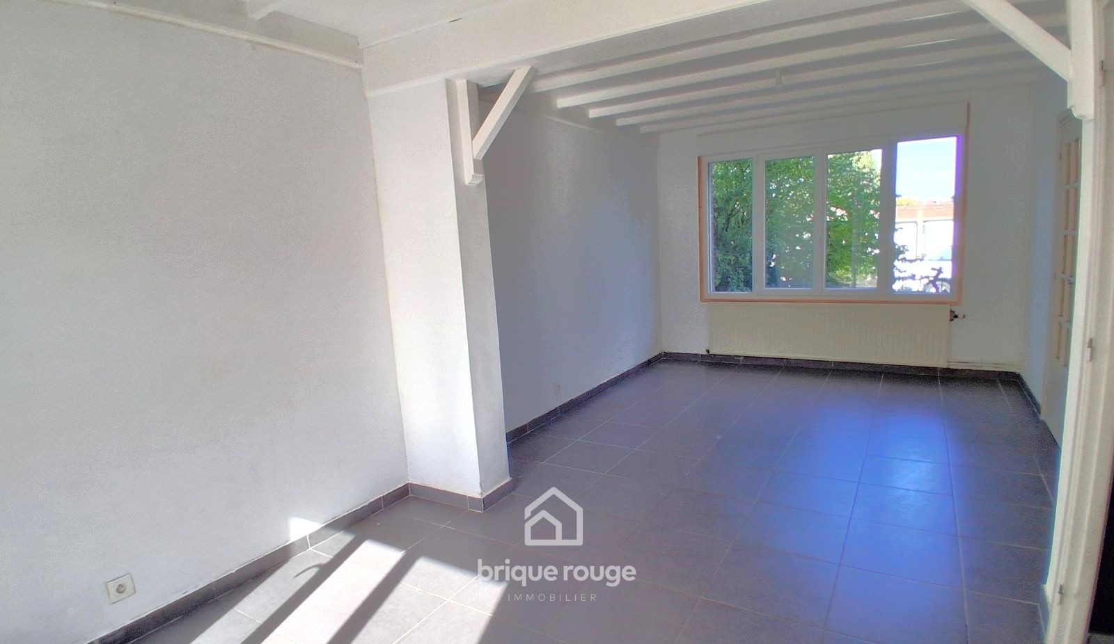 Maison semi individuelle 3 chambres et jardin Photo 2 - Brique Rouge Immobilier