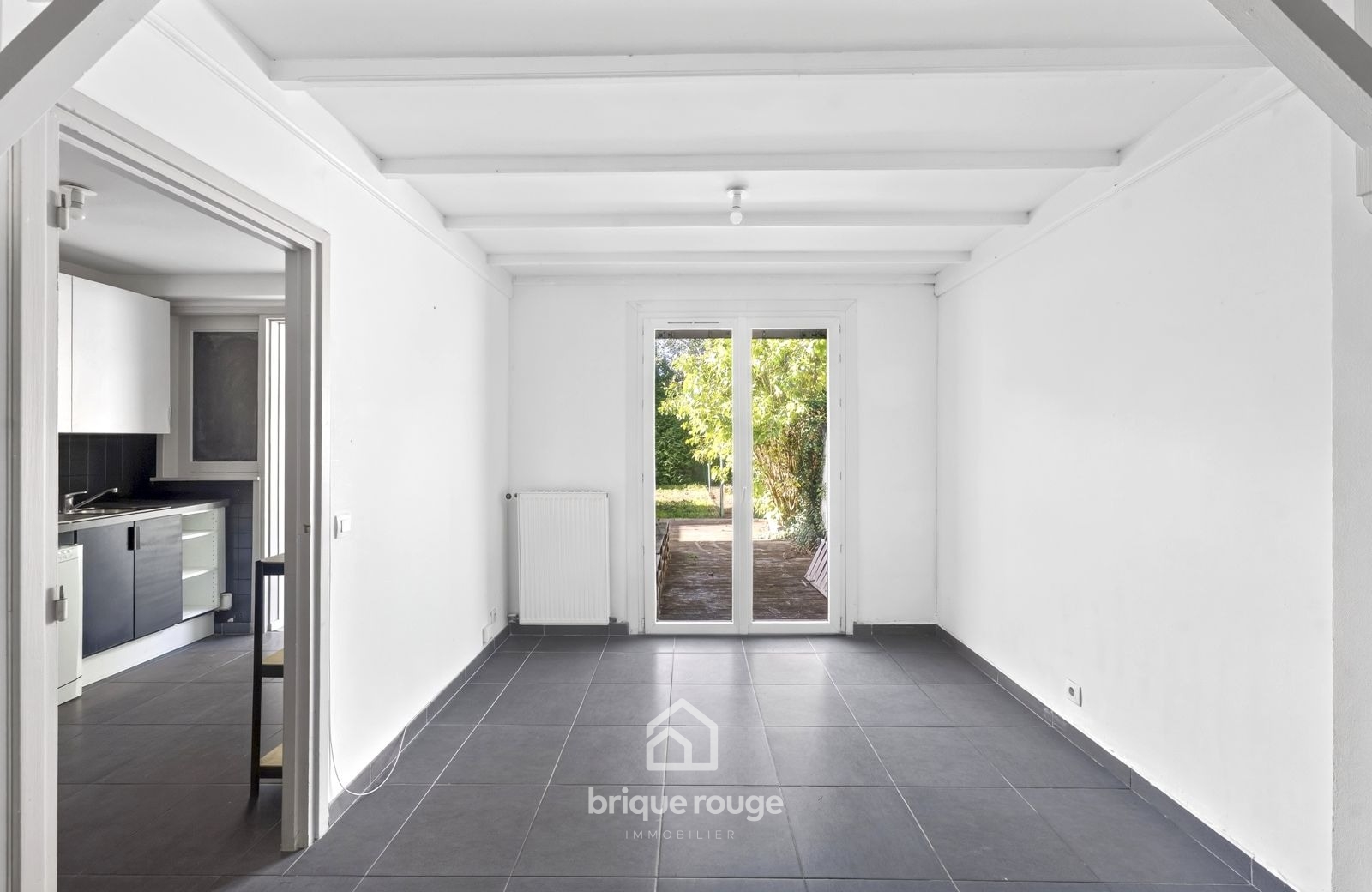 Maison semi individuelle 3 chambres et jardin Photo 4 - Brique Rouge Immobilier