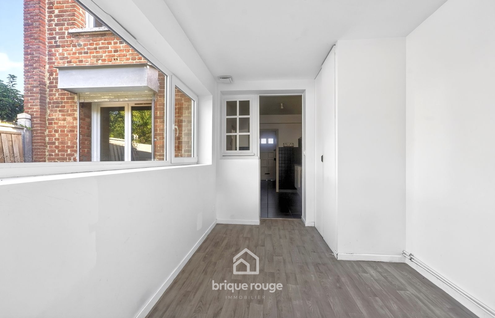 Maison semi individuelle 3 chambres et jardin Photo 7 - Brique Rouge Immobilier
